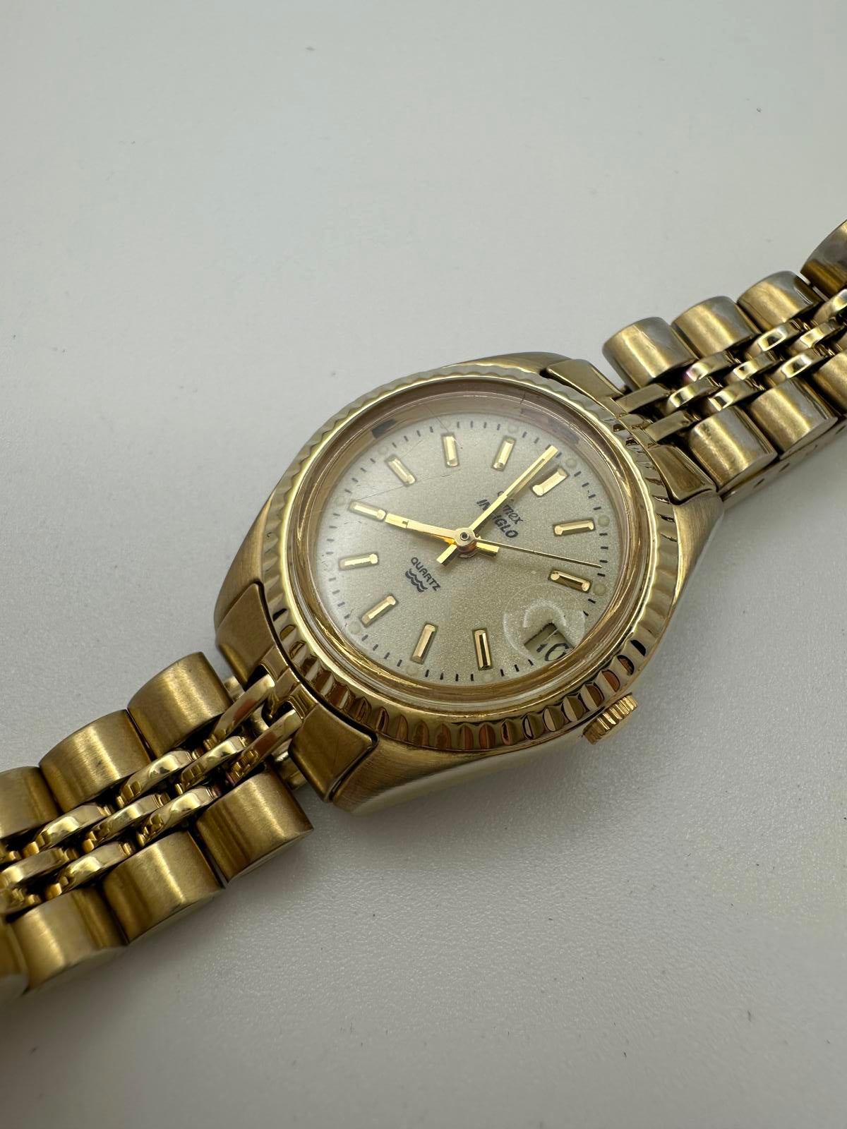 Vintage Timex Indiglo Quartz Watch – Gold Tone, Date Magnifier, Luminous Dial