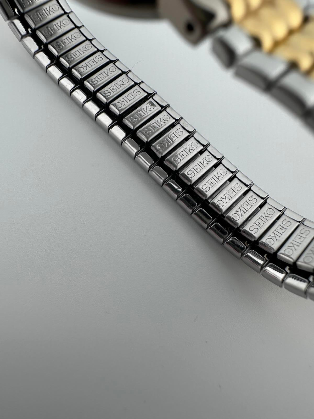 Seiko Womens Two Tone Silver Dial Quartz Stretch Bracelet Watch 1N00 3K78