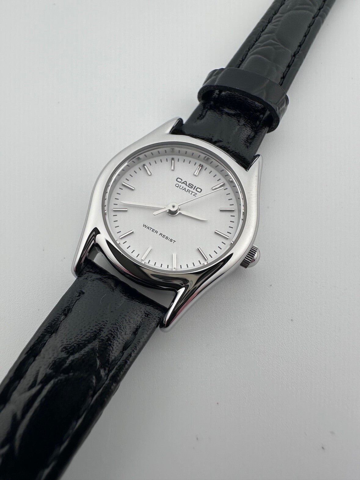 Casio Womens Quartz Watch 22mm Silver White Dial Black Leather LTP-1094E-7A