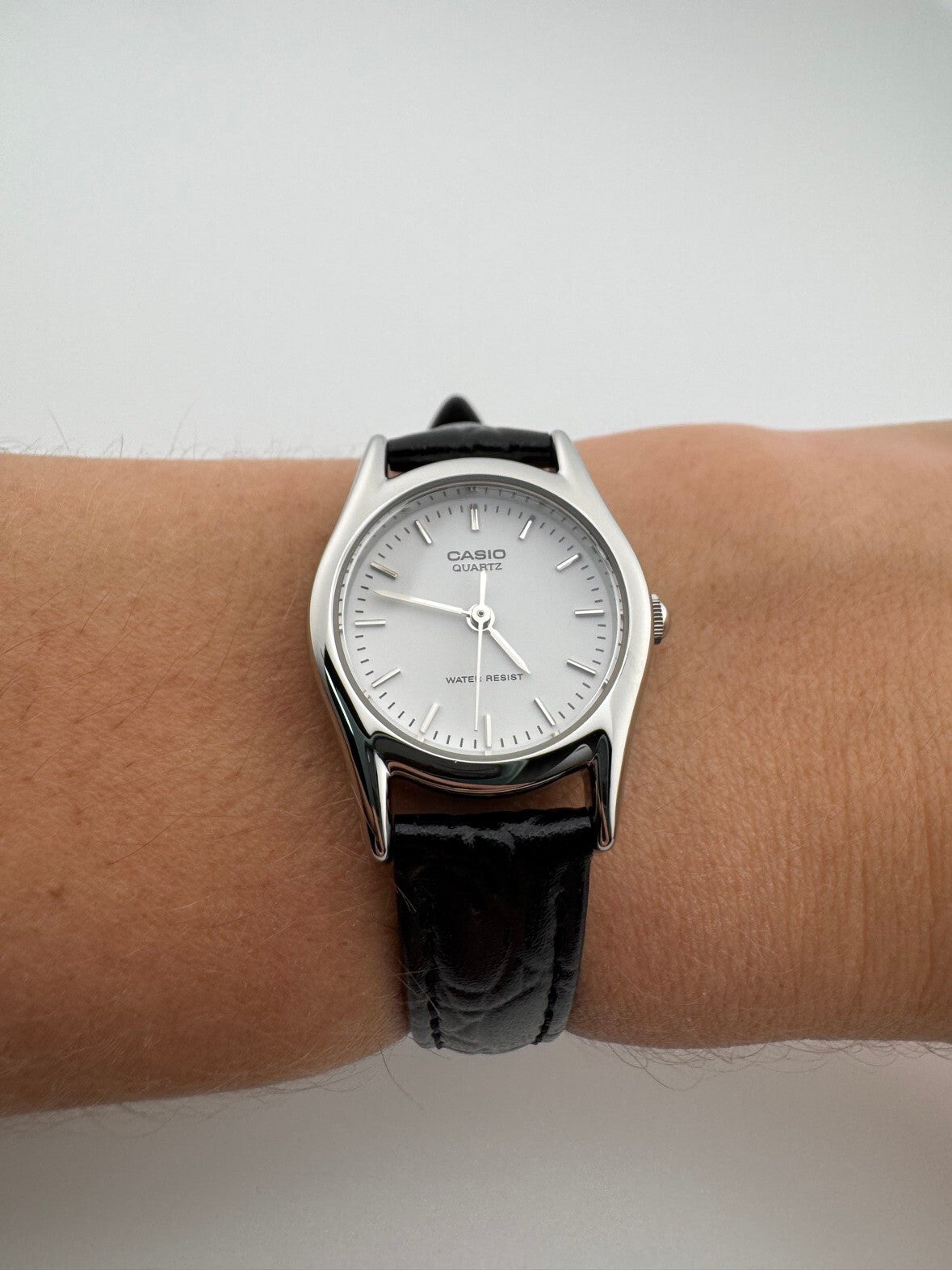 Casio Womens Quartz Watch 22mm Silver White Dial Black Leather LTP-1094E-7A