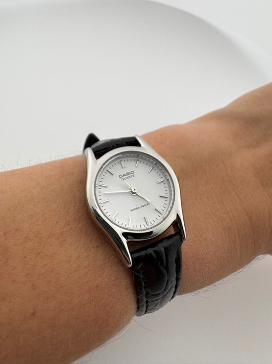 Casio Womens Quartz Watch 22mm Silver White Dial Black Leather LTP-1094E-7A