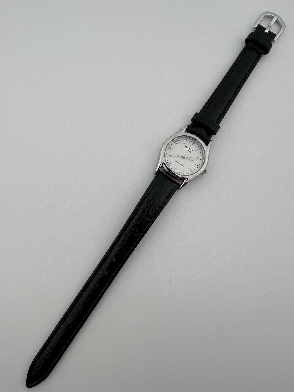 Casio Womens Quartz Watch 22mm Silver White Dial Black Leather LTP-1094E-7A