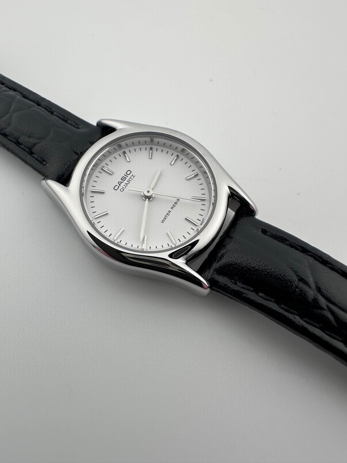 Casio Womens Quartz Watch 22mm Silver White Dial Black Leather LTP-1094E-7A