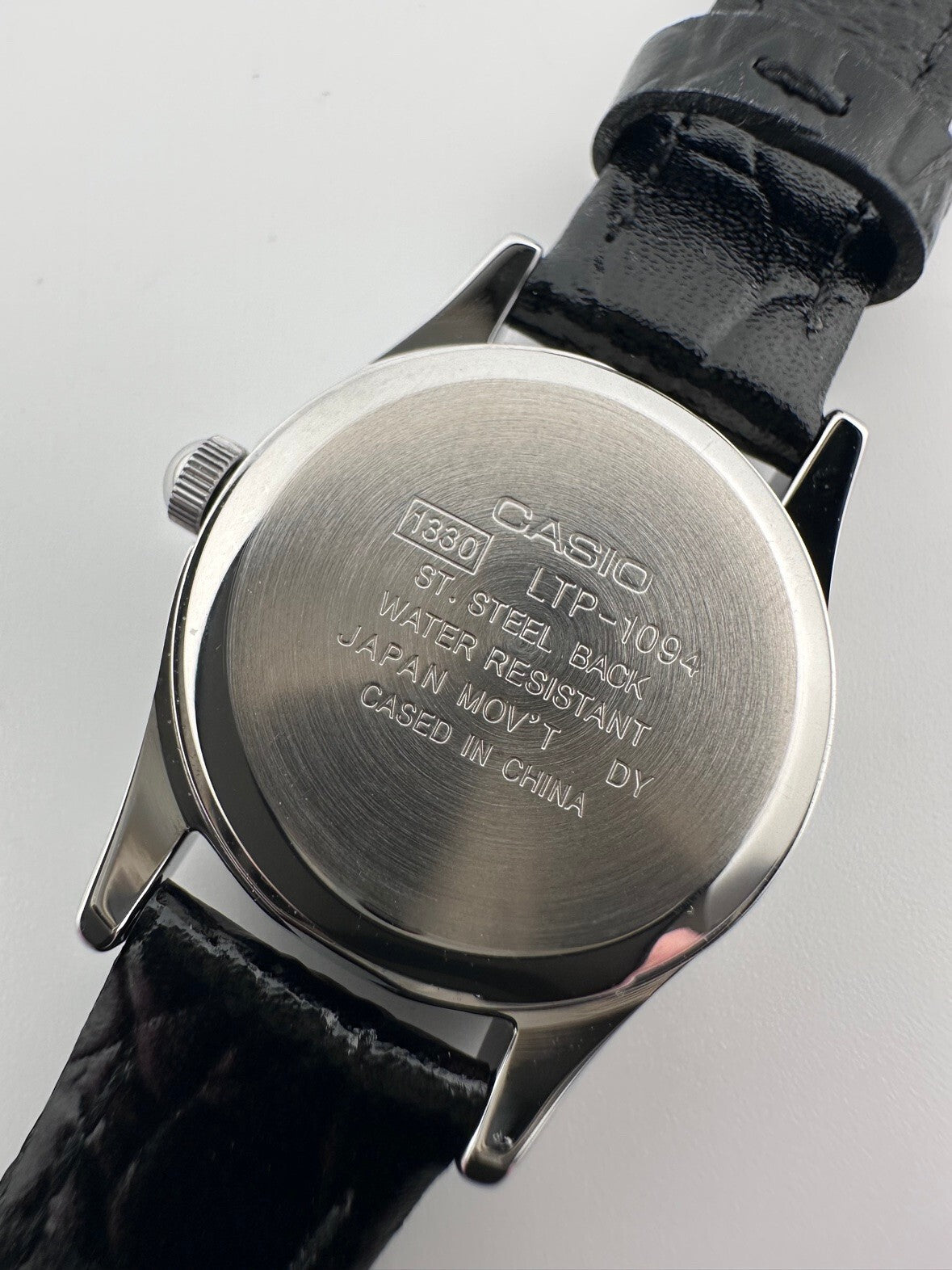 Casio Womens Quartz Watch 22mm Silver White Dial Black Leather LTP-1094E-7A